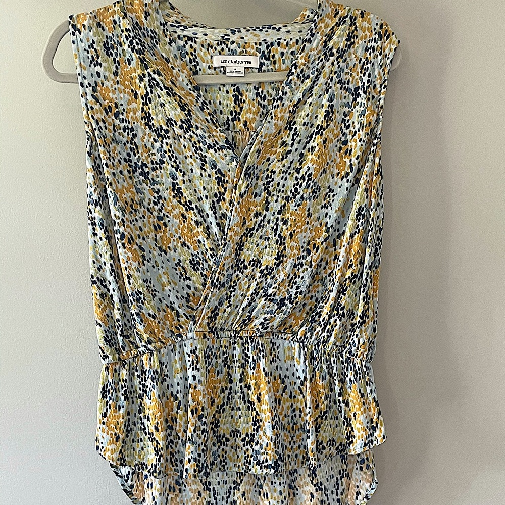 Sleeveless summer top. White with blue and yellow.